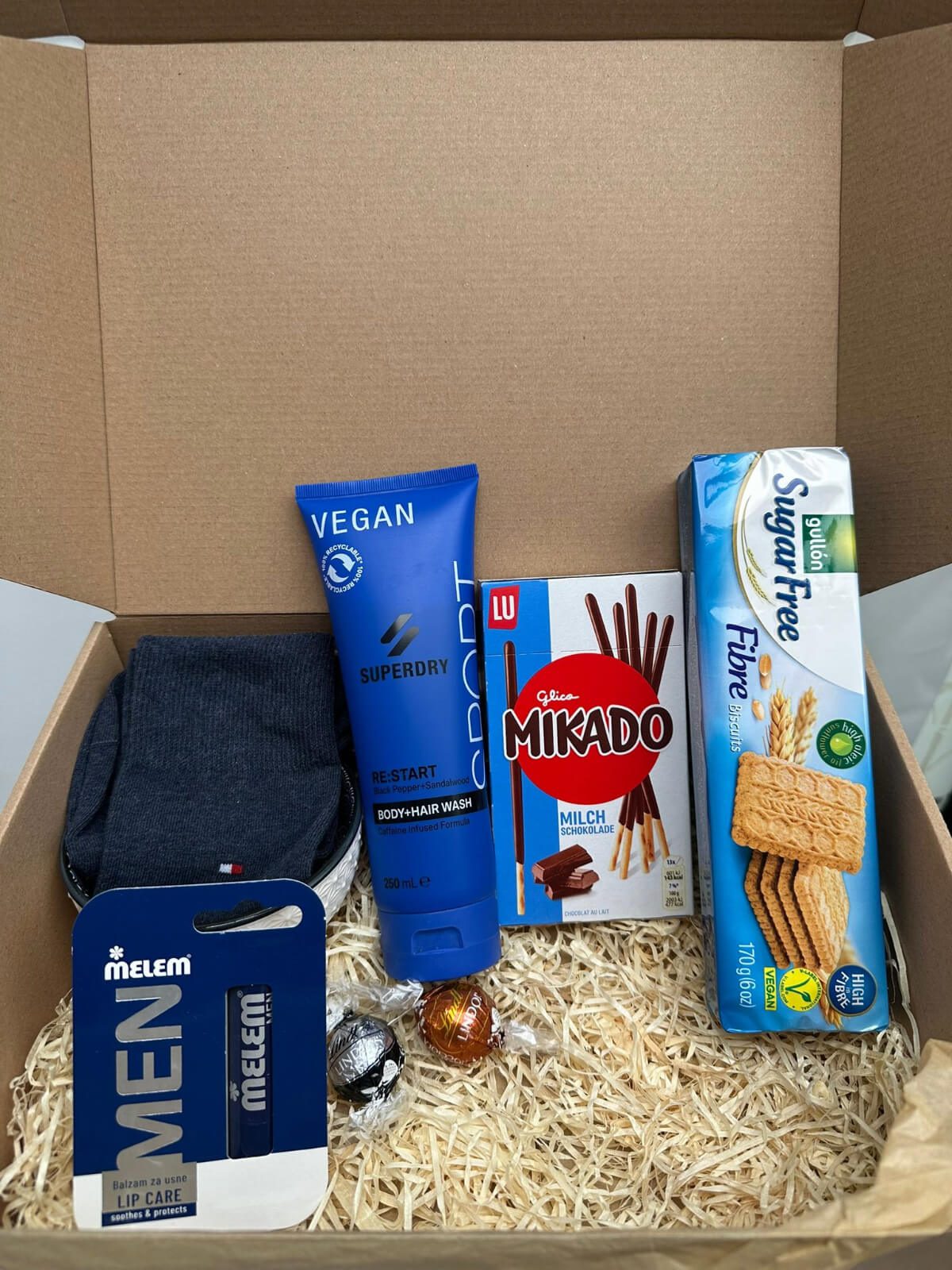 Men's Care Giftbox with grooming products and essentials for men.