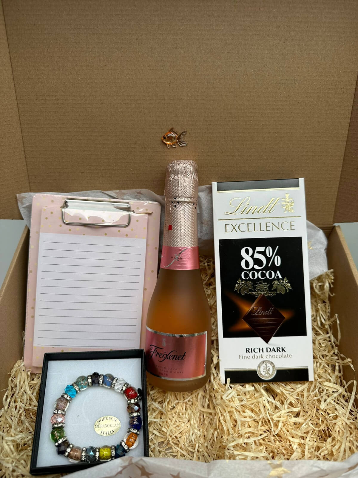 Colorful Murano glass bracelet displayed in an elegant gift box.