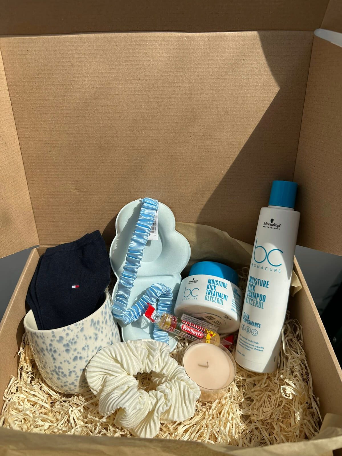 Hair Care Giftbox with various hair care products arranged neatly.