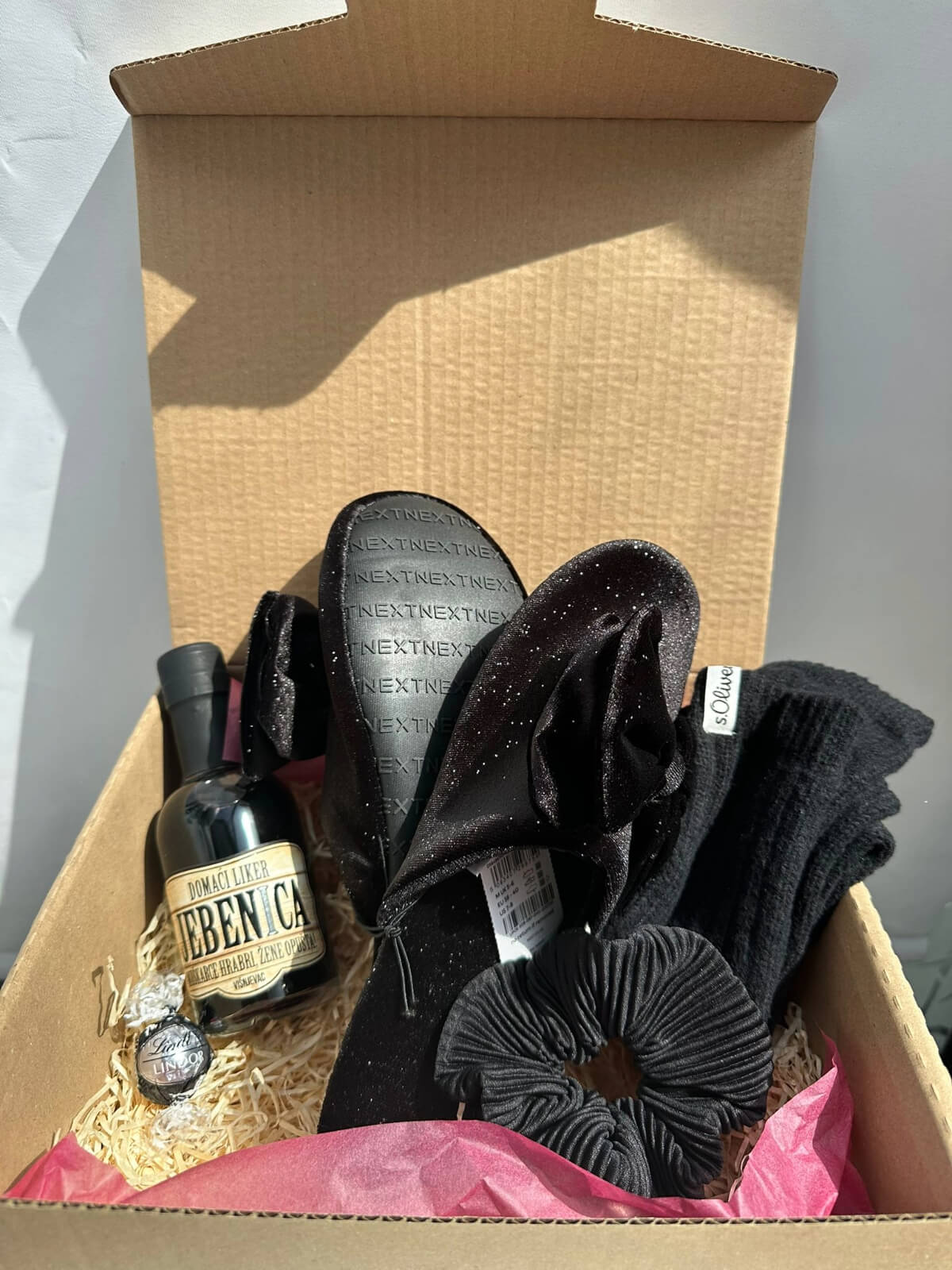 Elegant Glow slippers presented in a stylish gift box.