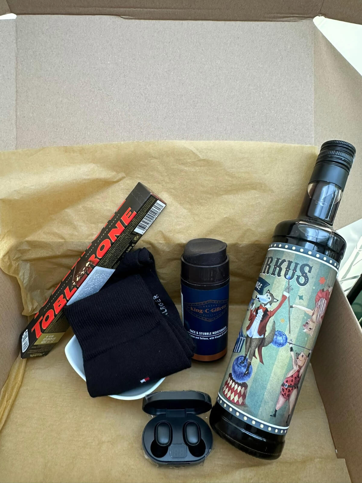 Liquor bottle and Toblerone chocolate gift box for a perfect indulgent treat.