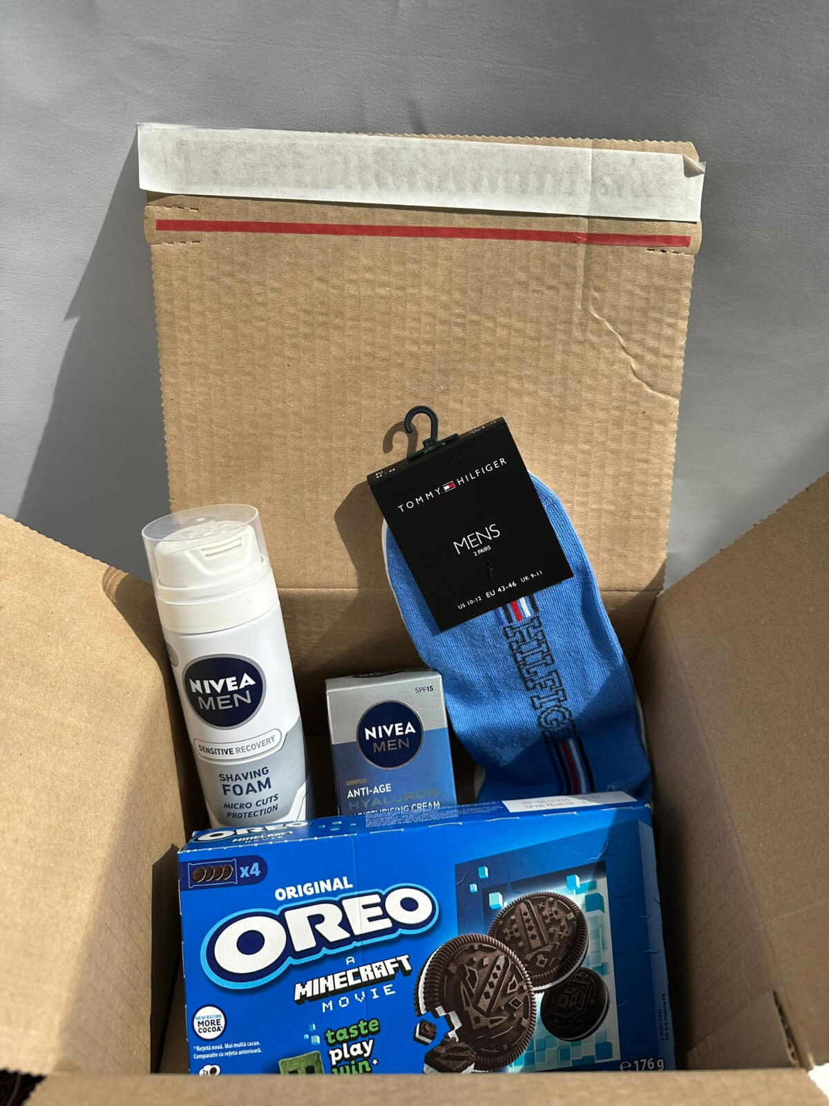 Nivea skincare products and Oreo cookies gift box for care and sweet treats.