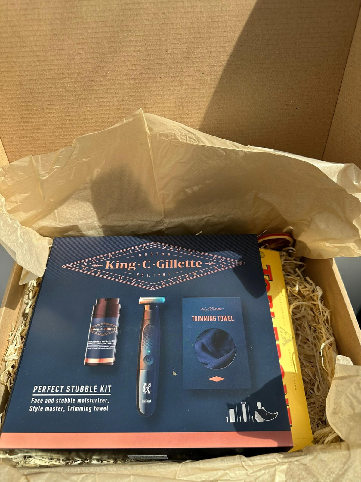 Gillette shaving products and Toblerone chocolate gift set for grooming and sweet enjoyment.