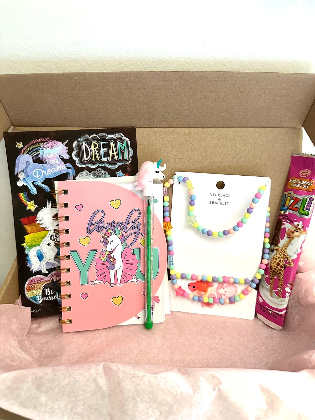 Unicorn girls gift box with colorful accessories and playful items for young unicorn fans.
